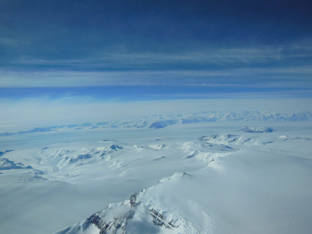 An aerial view of Antarctica's ice sheet and mountains