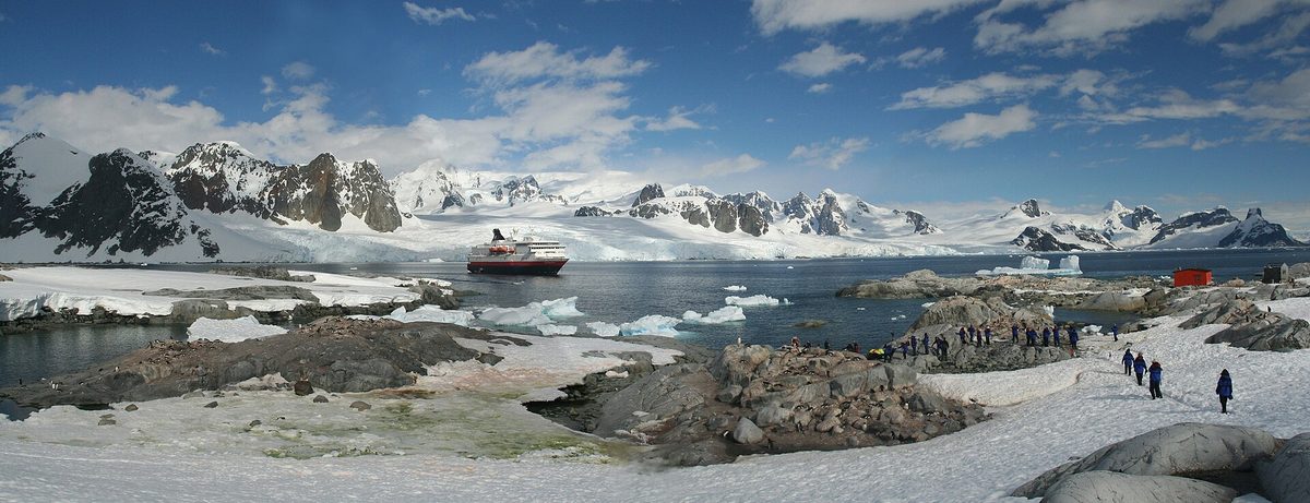 An expedition ship near a glacier in Antarctica