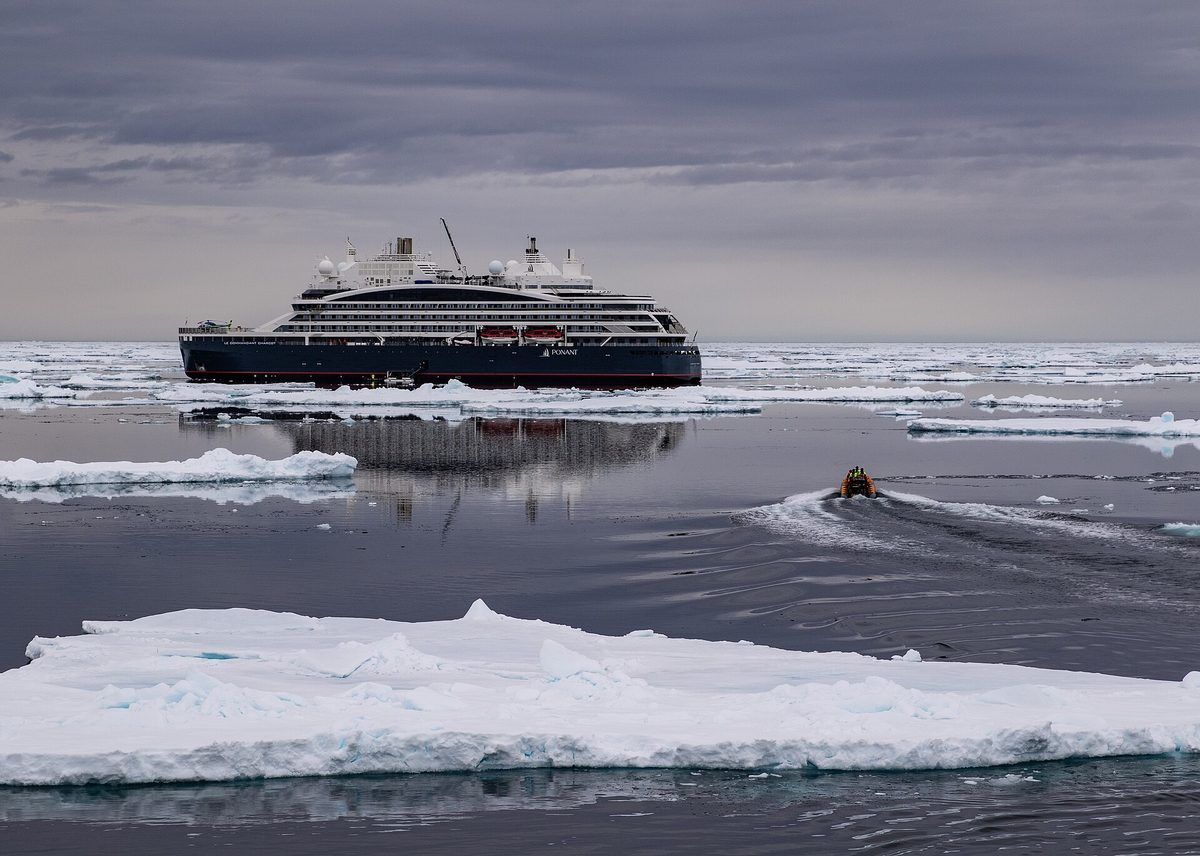Polar icebreaker cruise ship pushing through pack ice