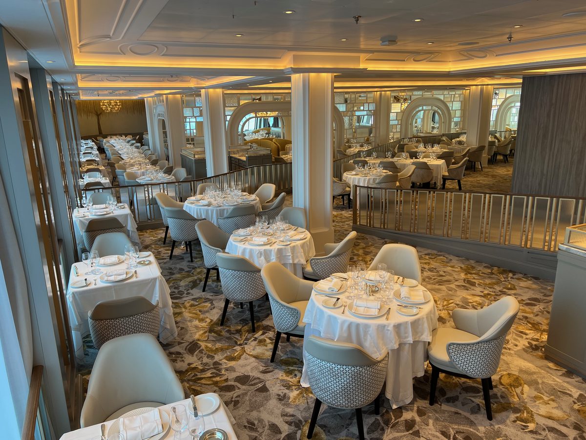 An elegant dining room aboard a modern expedition cruise ship