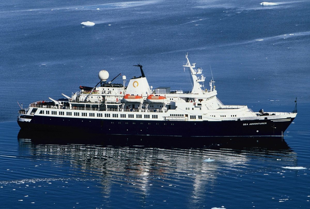 An expedition ship anchored in an Antarctic harbour