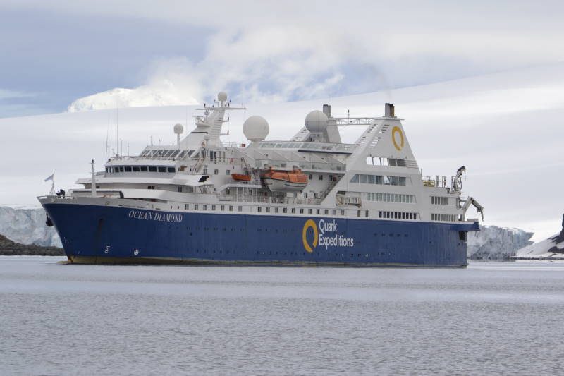 The expedition ship Ocean Diamond at anchor below an Antarctic glacier