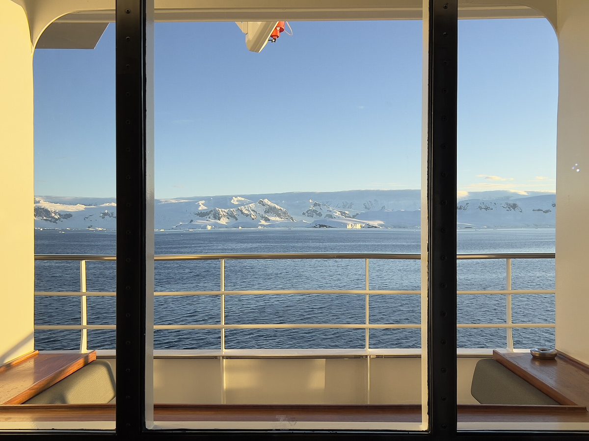 The Antarctic Peninsula seen through the window of an expedition cruise ship