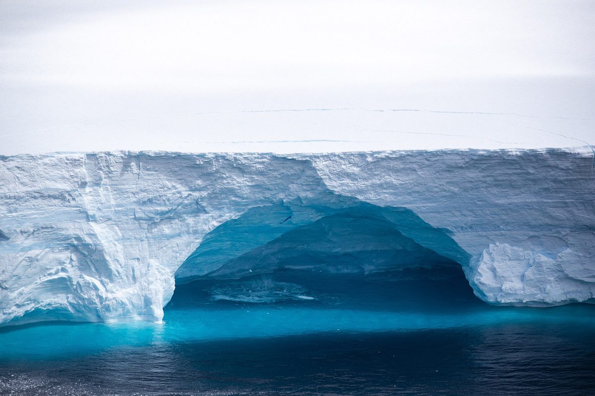 A large blue iceberg in the waters off the Antarctic Peninsula